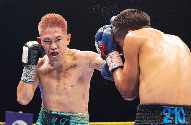 Joshua Franco absorbs a punch from Kazuto Ioka